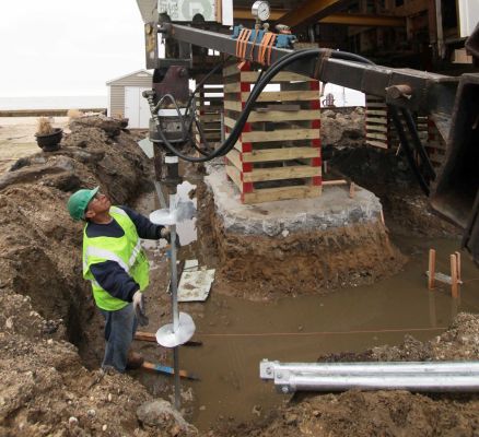 The house is first jacked up and placed